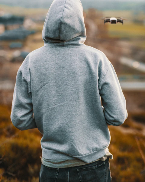 Person in a grey hoodie seen from behind