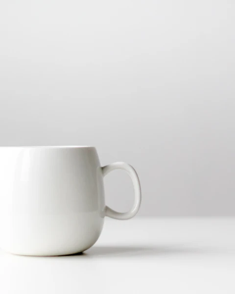 White ceramic mug on a clean table