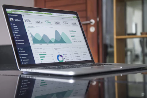 Laptop displaying marketing analytics charts